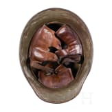 A steel helmet M 18 with camouflage painting