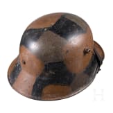 A steel helmet M 18 with camouflage painting
