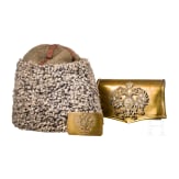 A fur hat, so-called "Papacha", a Russian belt buckle, and a cartridge box dummy