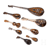 A group of seven miniature tortoiseshell and mother-of-pearl inlaid mandolins and one miniature guitar, Italy, late 19th / early 20th century