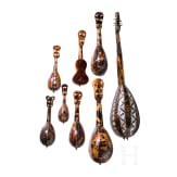 A group of seven miniature tortoiseshell and mother-of-pearl inlaid mandolins and one miniature guitar, Italy, late 19th / early 20th century