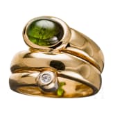 A 18ct gold snake-shaped ring with diamond and emerald