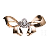 A 14ct gold and diamond loop-shaped brooch (ca. 0.445ct)
