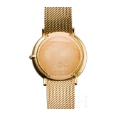 An 18-carat gold and quartz black dial Movado wristwatch with presentation box