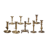 A group of nine brass candlesticks, 18th/19th century