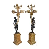 A pair of French partially gilt bronze candelabras, probably 20th century