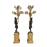 A pair of French partially gilt bronze candelabras, probably 20th century