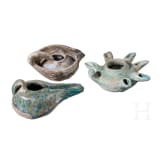 Three glazed Seljuk clay oil lamps, 12th &ndash; 13th century