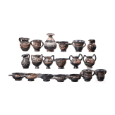 18 miniature vessels made of black glazed pottery, southern Italy, 4th &ndash; 3rd century B.C.