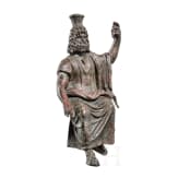 An enthroned Roman bronze statuette of Serapis, 2nd - 3rd century