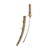 A carved ivory-mounted Wakizashi, late Edo period