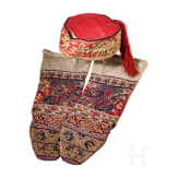 A Ottoman cap and two woollen stockings