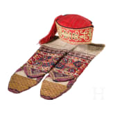 A Ottoman cap and two woollen stockings