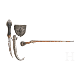A yemenite matchlock rifle with cartridge pouch and Khoumya, 19th and 20th century