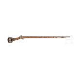A yemenite matchlock rifle with cartridge pouch and Khoumya, 19th and 20th century