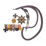 A visor cap for officers of the Jaeger battalions and some medals