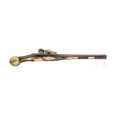 A flintlock pistol with fire-gilt mounts, circa 1720