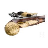 A flintlock pistol with fire-gilt mounts, circa 1720