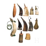 A set of twelve powder flasks, 18th/19th century.