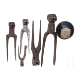 Set of five bullet tongs and a cannonball, German, 18th/19th century