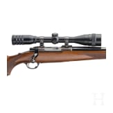 A Ruger Mod. M 77, with scope