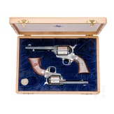 A pair of Colt revolvers - an SAA in .45LC and an SA Frontier Scout in .22lr., Commemorative, in case