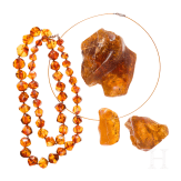 An amber necklace, an amber pendant and two amber chunks