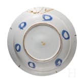 Five flower vase and swan pattern chargers, Delft, early 18th century (four) / circa 1800 (one)