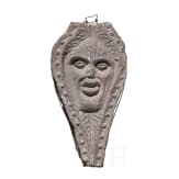 An English or Brittany basalt relief with the head of Green Man, 16th century