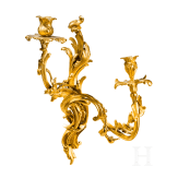 A German or French pair of fire gilt Louis XV sconces, mid-18th century