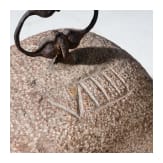 A German stone weight of nine pounds with iron handle, 17th century