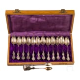Twelve silver partial-gilt tea spoons and a sugar tong with a case, stamped Russia, circa 1880