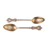 Twelve silver partial-gilt tea spoons and a sugar tong with a case, stamped Russia, circa 1880
