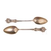 Twelve silver partial-gilt tea spoons and a sugar tong with a case, stamped Russia, circa 1880