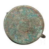 Bronze oil lamp on a disc-shaped base with floral and figurative decoration, Seljuk, 12th&ndash;13th centuries