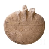 An alabaster disc decorated with incised patterns, a fragment of an Early Bronze Age idol, Cappadocia, late 3rd millennium B.C.