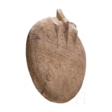 An alabaster disc decorated with incised patterns, a fragment of an Early Bronze Age idol, Cappadocia, late 3rd millennium B.C.