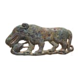 Bronze appliqu&eacute; depicting a big cat holding a snake in its paws, 4th century B.C.