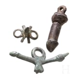 Two bronze phallic amulets and a spur, Roman, 2nd&ndash;3rd centuries.