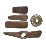 Five Copper Age artifacts: three flat axes, one axe with diagonally set edges, and a decorative spiral; Southeastern Europe, late 5th millennium &ndash; 4th millennium B.C.