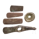 Five Copper Age artifacts: three flat axes, one axe with diagonally set edges, and a decorative spiral; Southeastern Europe, late 5th millennium &ndash; 4th millennium B.C.