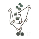 A set of Bronze Age jewellery, strung in modern times, together with two finger rings and two curl rings, 10th&ndash;9th centuries B.C.