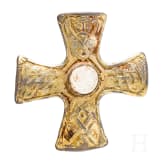 A brooch made of gold-plated silver in the shape of a cross, depicting Odin and his ravens, Viking, 10th century.