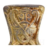 A brooch made of gold-plated silver in the shape of a cross, depicting Odin and his ravens, Viking, 10th century.