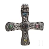 A silver cross-shaped pendant with punched decoration and inlays, Viking, 10th century.