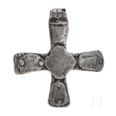 A silver cross-shaped pendant with punched decoration and inlays, Viking, 10th century.