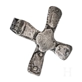 A silver cross-shaped pendant with punched decoration and inlays, Viking, 10th century.