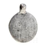 Round silver pendant depicting Thor with Hugin and Munin, 10th century.