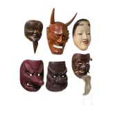 Sechs Masken aus Gusseisen und Holz, Japan, 20. Jhdt.
