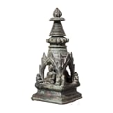 Bronze votive stupa with a reliquary chamber and depictions of Shakyamuni Buddha, flanked by two worshippers. Pagan Kingdom (Myanmar), 12th &ndash; 13th centuries.